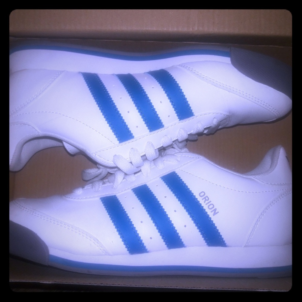 White and teal adidas tennis shoes